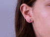 14kt White Gold Diamod Bezel Earrings worn by a woman