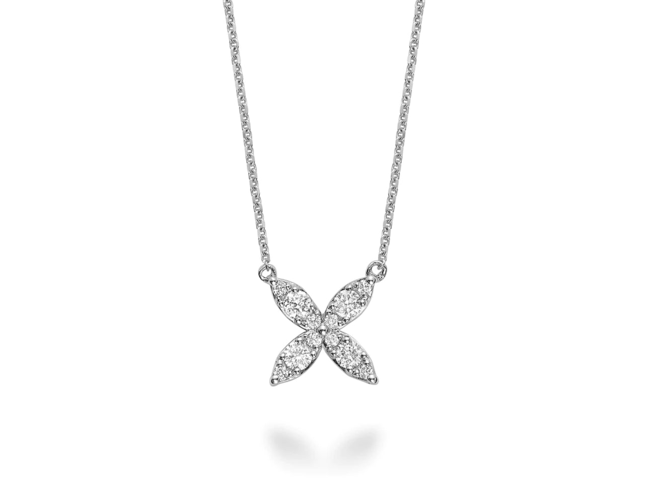 A diamond flower necklace made of 14kt white gold. The necklace is accented with a total weight of 0.20cts of diamonds and features a delicate flower pendant with a sparkling cluster of diamonds in the center.