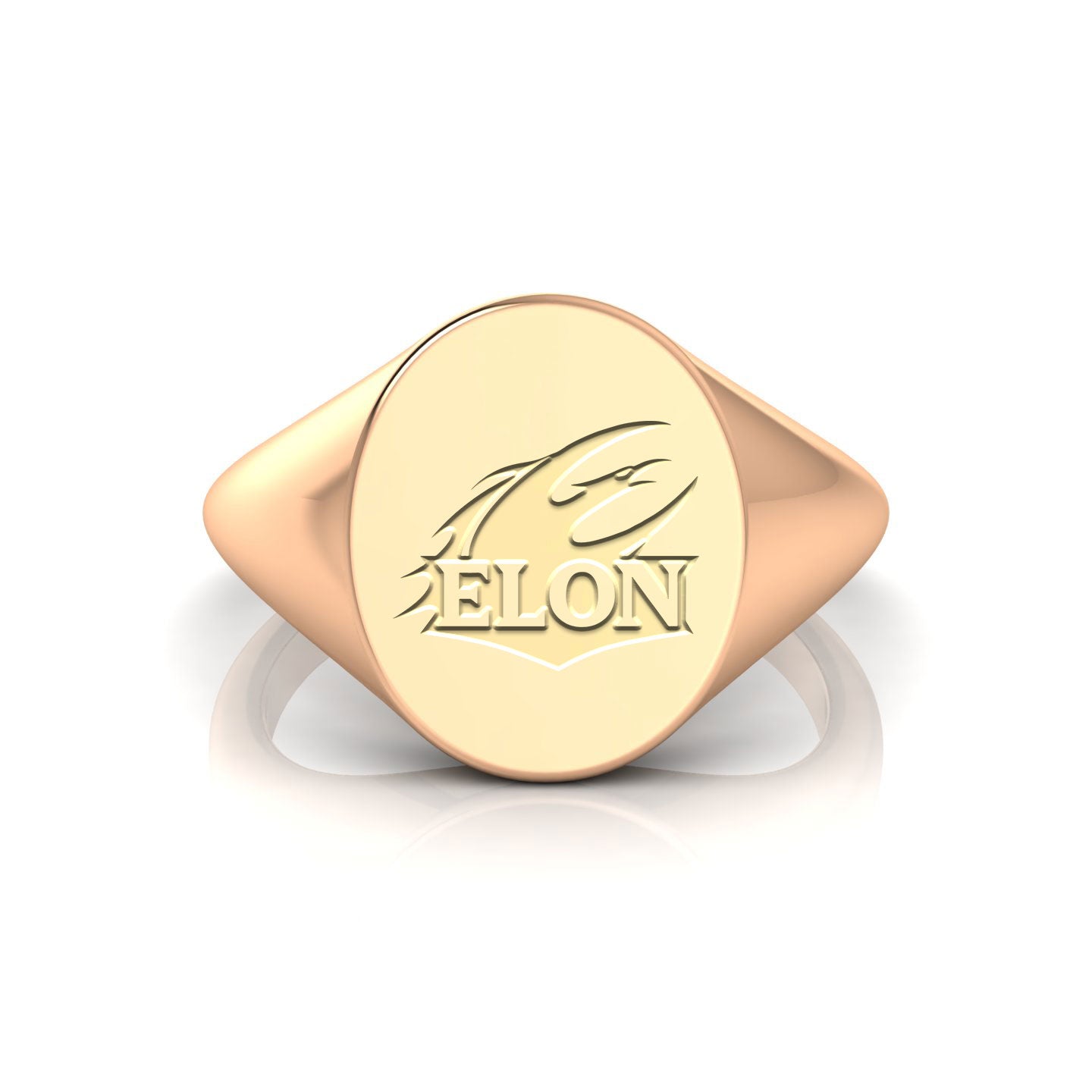 A close-up of an Elon University Oval Heritage Class Ring in 14kt yellow gold. The class ring is oval-shaped with Elon University's signature logo. The logo is engraved in the center of the ring and is surrounded by the university's name and logo. The class ring is made of high-quality 14kt yellow gold and has a comfortable fit.