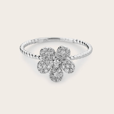 A stunning 18kt White Gold Diamond Florette Ring showcasing a delicate floral design with sparkling diamonds at its center, radiating elegance and sophistication.