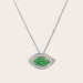 This image shows a close up view of the Evil Eye Tsavorite and Diamond Pendant. The pendant is made of 18kt white gold and features approximately 0.34cts of sparkling white diamonds and 0.47cts of vibrant tsavorite stones. The evil eye design is a classic symbol of protection, and the combination of the tsavorite and diamonds creates a truly eye-catching look. The details of the pendant are beautifully crafted and showcase the quality of the materials.