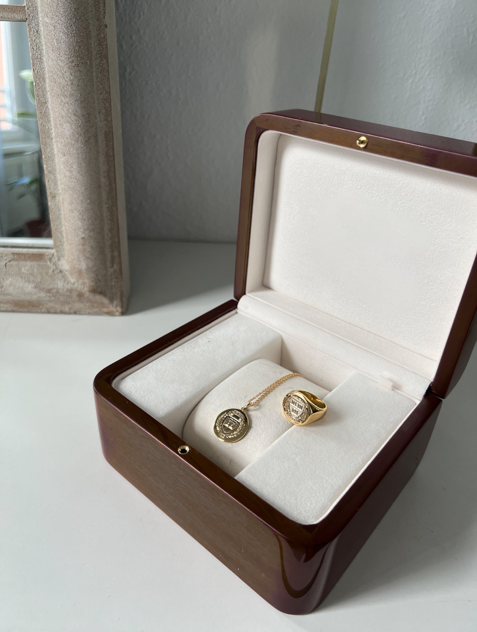 The Harvard Statement Class Ring beautifully displayed in a jewelry box, highlighting its stunning details and superior quality.