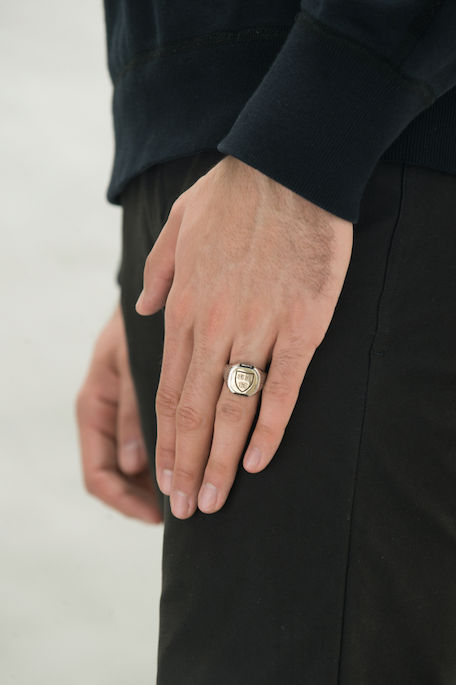 Harvard Limited Edition Honour Class Ring worn by a man - side view. The ring, seen from the side, showcases its impeccable design and the wearer's affiliation with Harvard University.